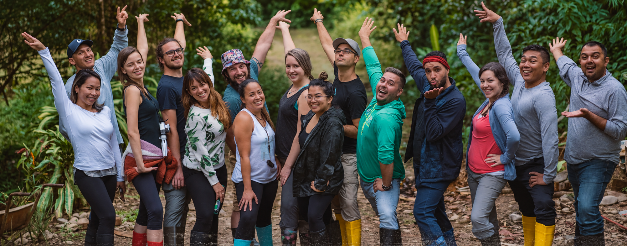 Travel Tribe group standing together on a lush forest trail